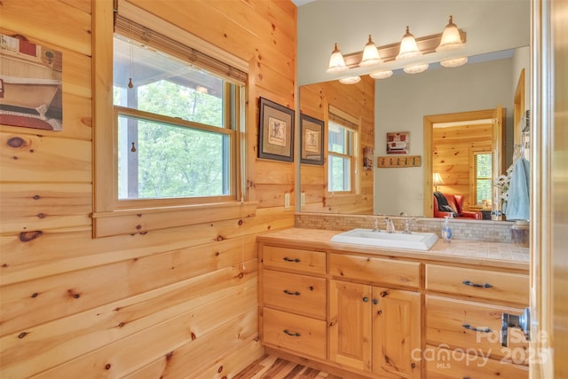 265 Laurel Mountain Estates Dr, Todd, NC 28684 - bathroom featuring vanity, wood walls, and healthy amount of natural light