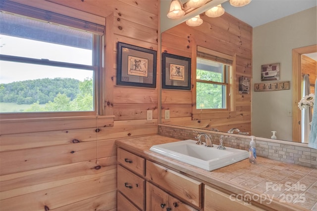 265 Laurel Mountain Estates Dr, Todd, NC 28684 - bathroom featuring backsplash, vanity, and wooden walls