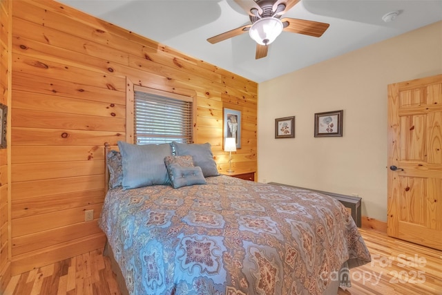 265 Laurel Mountain Estates Dr, Todd, NC 28684 - bedroom with wood finished floors, wood walls, and ceiling fan