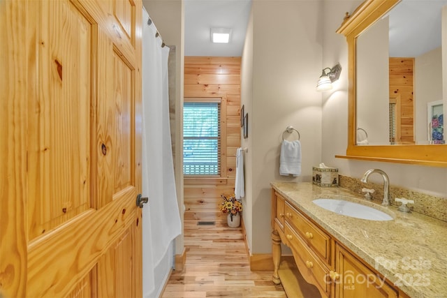 265 Laurel Mountain Estates Dr, Todd, NC 28684 - bathroom featuring vanity, wood finished floors, and wood walls