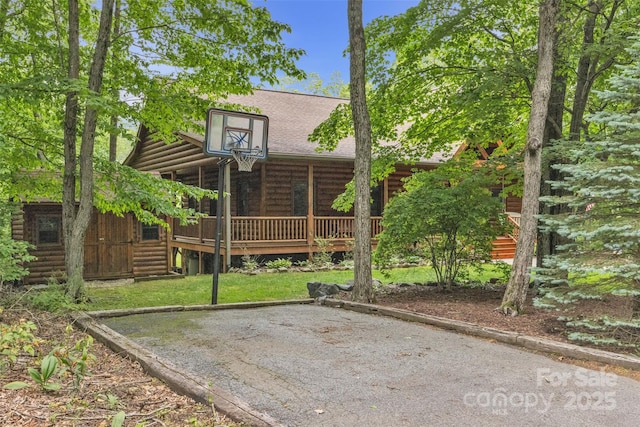 265 Laurel Mountain Estates Dr, Todd, NC 28684 - back of house with log veneer siding, a wooden deck, and roof with shingles
