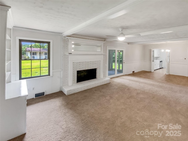 302 Melinda Ave, Kannapolis, NC 28083 - unfurnished living room with plenty of natural light, carpet, a brick fireplace, a ceiling fan, and beam ceiling