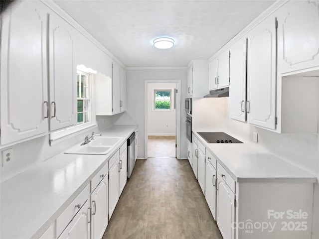 302 Melinda Ave, Kannapolis, NC 28083 - kitchen with a sink, black appliances, under cabinet range hood, and white cabinets