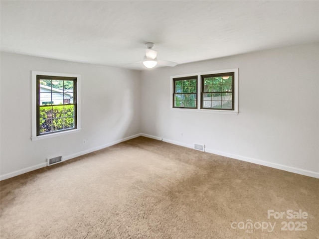 302 Melinda Ave, Kannapolis, NC 28083 - spare room with plenty of natural light, carpet flooring, ceiling fan, and baseboards