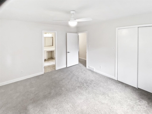 302 Melinda Ave, Kannapolis, NC 28083 - unfurnished bedroom with carpet flooring, a closet, baseboards, and ceiling fan