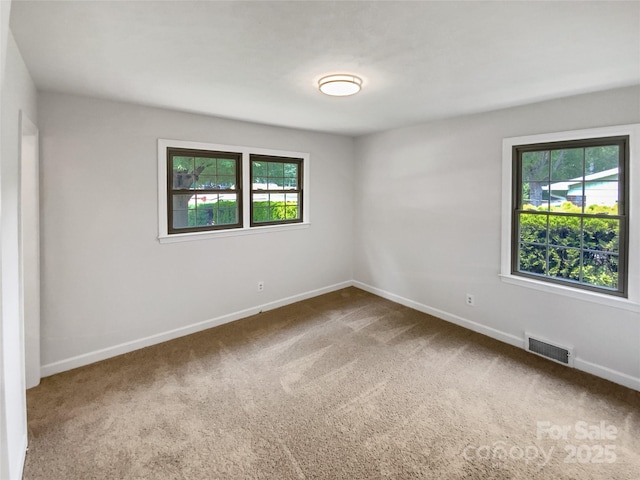 302 Melinda Ave, Kannapolis, NC 28083 - spare room featuring carpet floors and baseboards