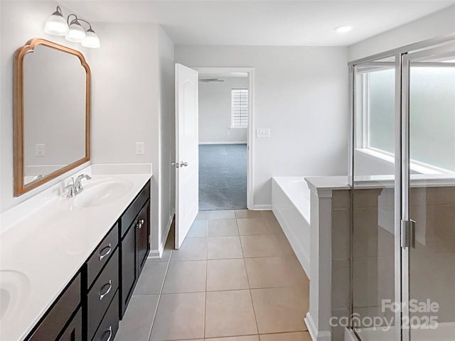 1680 Trentwood Dr, Fort Mill, SC 29715 - bathroom featuring double vanity, a bath, baseboards, tile patterned floors, and a stall shower