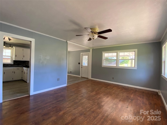 1300 Montgomery Ave, Albemarle, NC 28001 - unfurnished room with a ceiling fan, crown molding, healthy amount of natural light, and dark wood-style flooring