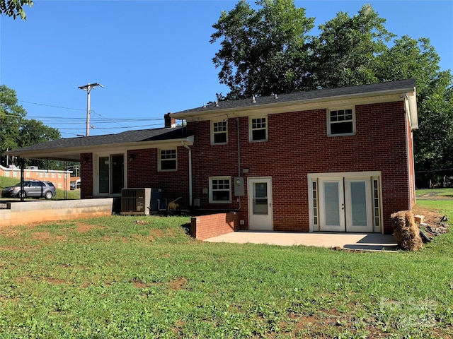1300 Montgomery Ave, Albemarle, NC 28001 - rear view of property with a lawn, a patio area, brick siding, and french doors