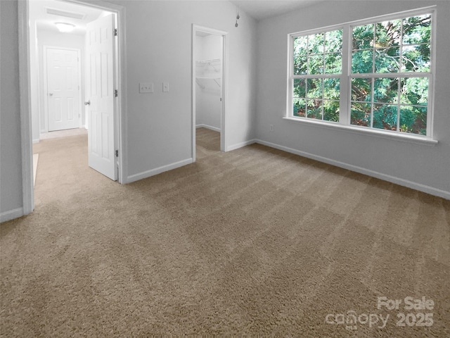 1573 Maypine Commons Way, Rock Hill, SC 29732 - unfurnished bedroom featuring carpet floors, a spacious closet, baseboards, and a closet