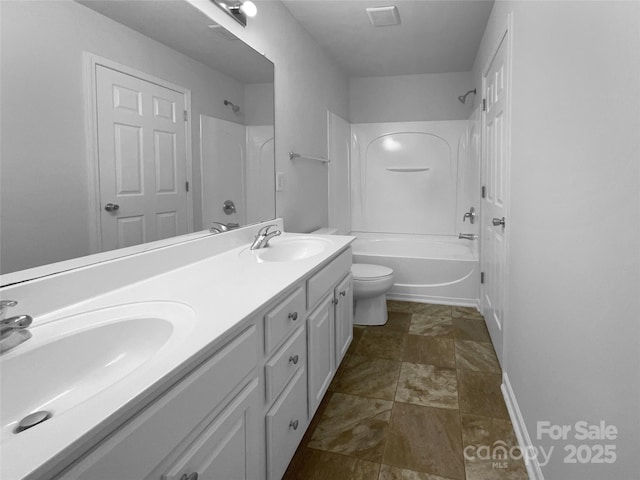 1573 Maypine Commons Way, Rock Hill, SC 29732 - bathroom with double vanity, toilet, shower / bathtub combination, baseboards, and stone finish flooring