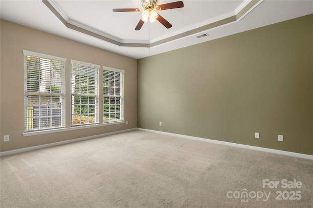 56119 Finches Ct, Indian Land, SC 29707 - unfurnished room with a tray ceiling, crown molding, carpet floors, and ceiling fan