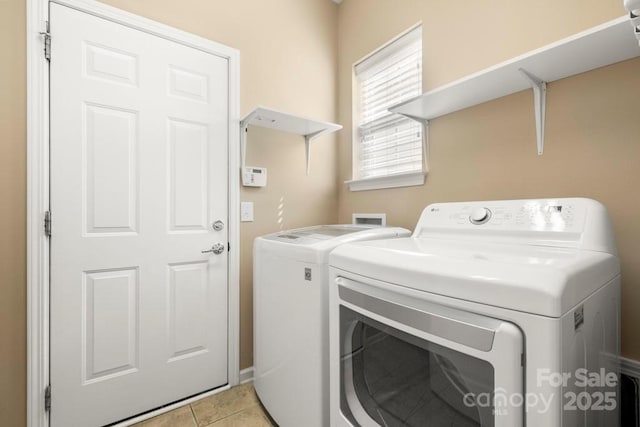 56119 Finches Ct, Indian Land, SC 29707 - laundry area with washing machine and dryer and light tile patterned floors