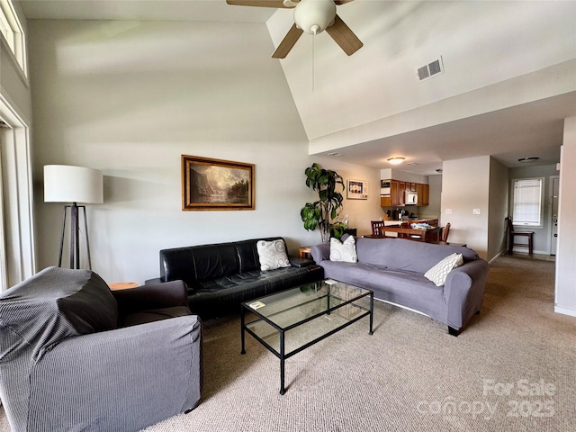 116 Grand Blvd Unit 4-B, Boone, NC 28607 - living area with light carpet, a ceiling fan, a high ceiling, and baseboards