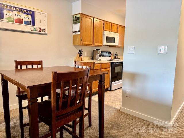 116 Grand Blvd Unit 4-B, Boone, NC 28607 - dining space featuring light colored carpet and baseboards