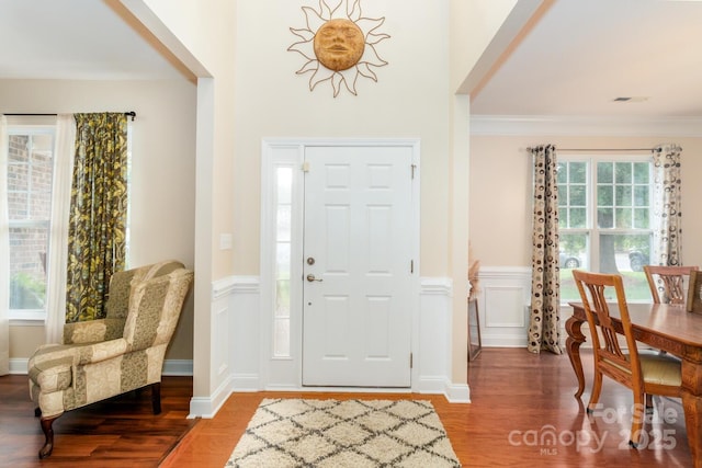 1006 Apogee Dr, Indian Trail, NC 28079 - entryway featuring wood finished floors, a wainscoted wall, and crown molding