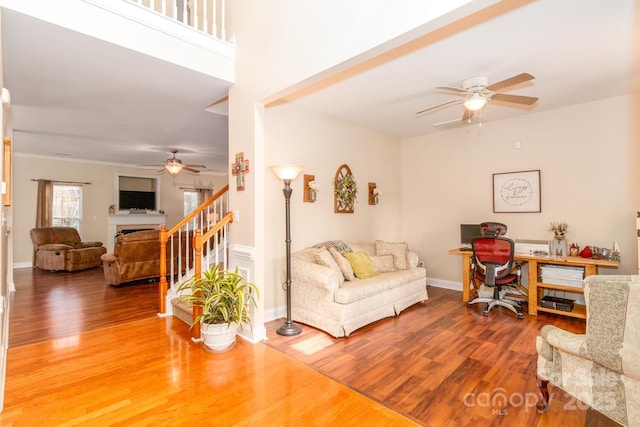 1006 Apogee Dr, Indian Trail, NC 28079 - living room with ceiling fan, a desk, wood finished floors, and stairway