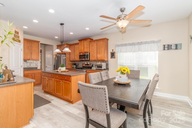 1006 Apogee Dr, Indian Trail, NC 28079 - dining area with light wood-style flooring, ceiling fan, and recessed lighting