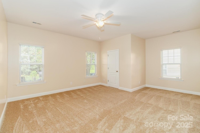 1006 Apogee Dr, Indian Trail, NC 28079 - spare room featuring light colored carpet and ceiling fan