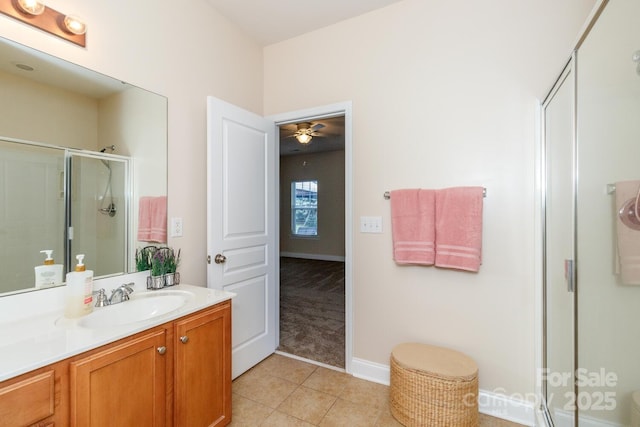 1006 Apogee Dr, Indian Trail, NC 28079 - bathroom featuring a shower stall, vanity, tile patterned flooring, and a ceiling fan