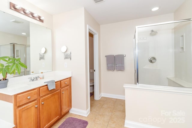 1006 Apogee Dr, Indian Trail, NC 28079 - full bathroom with a shower stall, vanity, and tile patterned flooring