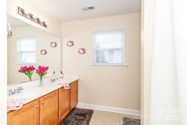 1006 Apogee Dr, Indian Trail, NC 28079 - bathroom featuring double vanity and tile patterned flooring