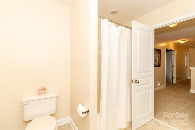 1006 Apogee Dr, Indian Trail, NC 28079 - bathroom featuring toilet and baseboards