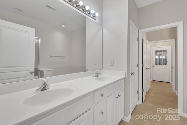 5963 Pale Moss Ln, Charlotte, NC 28269 - bathroom with double vanity and baseboards