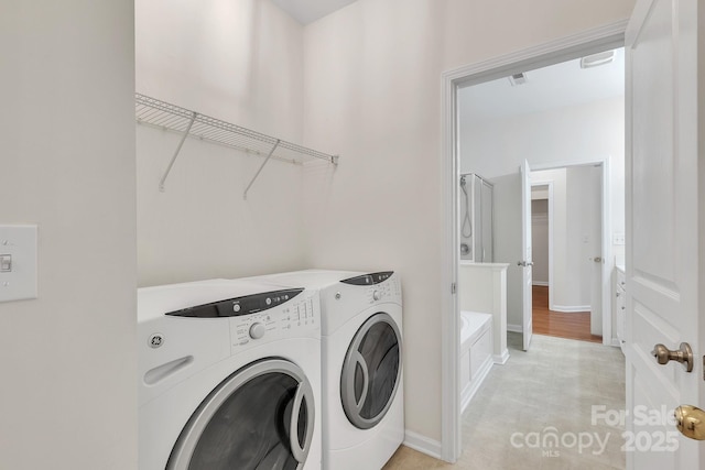 5963 Pale Moss Ln, Charlotte, NC 28269 - washroom featuring washing machine and dryer and baseboards
