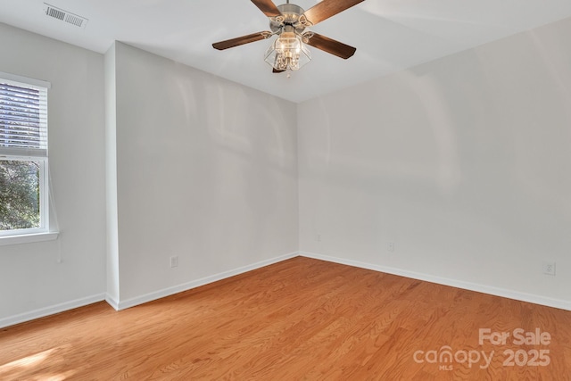 5963 Pale Moss Ln, Charlotte, NC 28269 - empty room with light wood-type flooring, healthy amount of natural light, and baseboards
