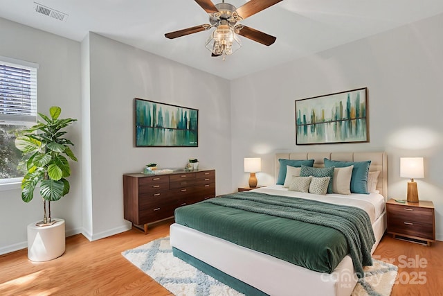 5963 Pale Moss Ln, Charlotte, NC 28269 - bedroom featuring light wood finished floors, baseboards, and a ceiling fan