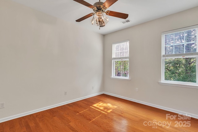 5963 Pale Moss Ln, Charlotte, NC 28269 - spare room featuring light wood-style flooring, baseboards, and ceiling fan