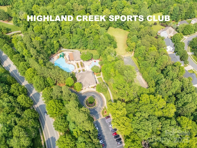 5963 Pale Moss Ln, Charlotte, NC 28269 - view of property location with a pool and a heavily wooded area