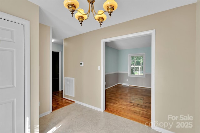 2326 Horseshoe Bend Rd NE, Hickory, NC 28601 - hallway featuring a chandelier and light tile patterned flooring