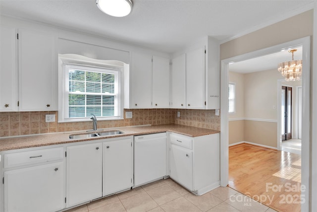 2326 Horseshoe Bend Rd NE, Hickory, NC 28601 - kitchen with dishwasher, backsplash, white cabinets, and light tile patterned floors