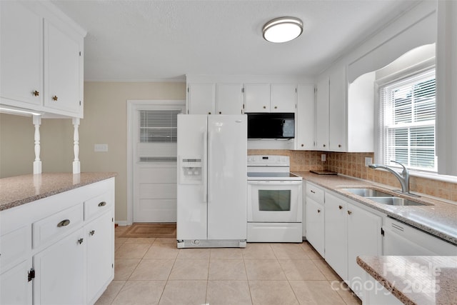 2326 Horseshoe Bend Rd NE, Hickory, NC 28601 - kitchen featuring white appliances, white cabinets, decorative backsplash, light tile patterned floors, and light stone counters
