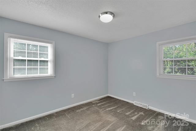 2326 Horseshoe Bend Rd NE, Hickory, NC 28601 - unfurnished room with dark carpet and a textured ceiling