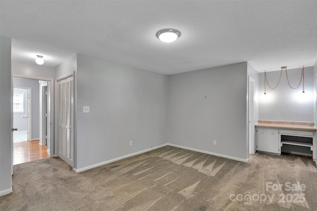 2326 Horseshoe Bend Rd NE, Hickory, NC 28601 - unfurnished bedroom featuring carpet floors, a textured ceiling, a closet, and an office area