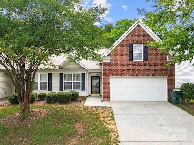 4510 Glenlea Commons Dr, Charlotte, NC 28216 - view of front of home with driveway, an attached garage, and brick siding
