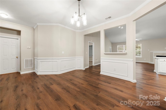 4510 Glenlea Commons Dr, Charlotte, NC 28216 - unfurnished dining area with a chandelier, crown molding, wood finished floors, and a wainscoted wall