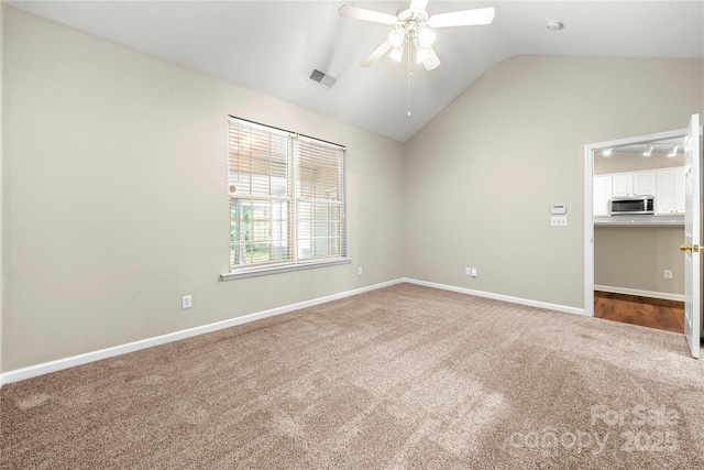 4510 Glenlea Commons Dr, Charlotte, NC 28216 - carpeted empty room with lofted ceiling, a ceiling fan, and baseboards