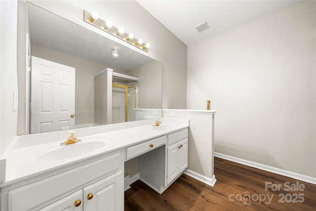 4510 Glenlea Commons Dr, Charlotte, NC 28216 - full bath featuring double vanity, wood finished floors, baseboards, and a shower with door