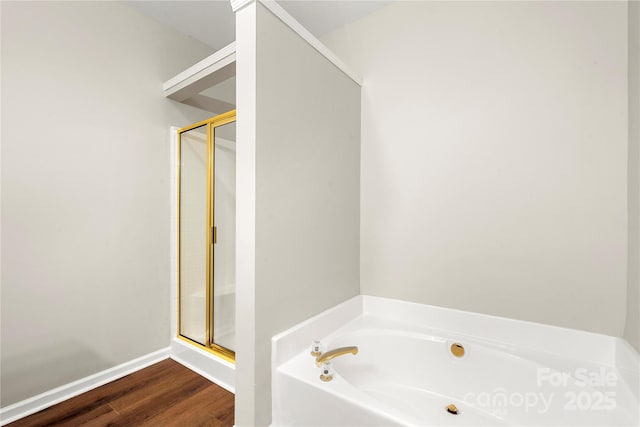 4510 Glenlea Commons Dr, Charlotte, NC 28216 - full bath featuring a bath, a stall shower, wood finished floors, and baseboards