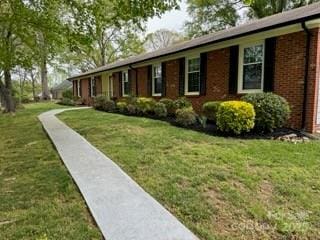 8616 Fallsdale Dr, Charlotte, NC 28214 - view of front of house featuring brick siding and a front yard