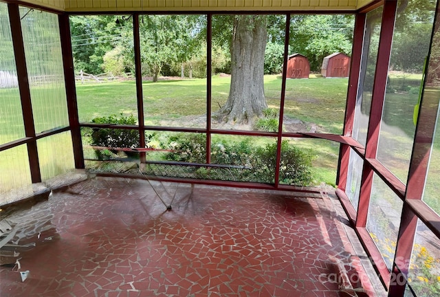 8616 Fallsdale Dr, Charlotte, NC 28214 - unfurnished sunroom with stone floors