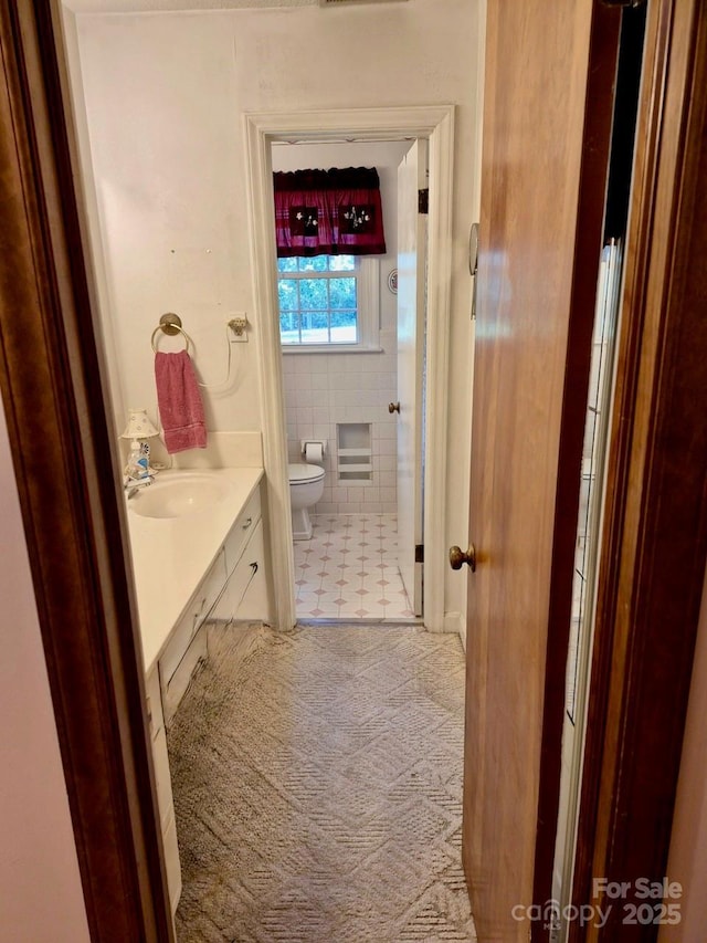 8616 Fallsdale Dr, Charlotte, NC 28214 - bathroom featuring vanity and tile walls