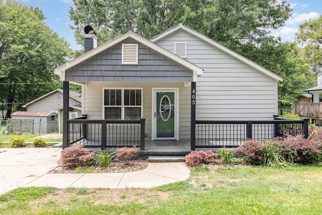 403 Weaver St, Cherryville, NC 28021 - view of front of house with a porch, a chimney, and a front lawn