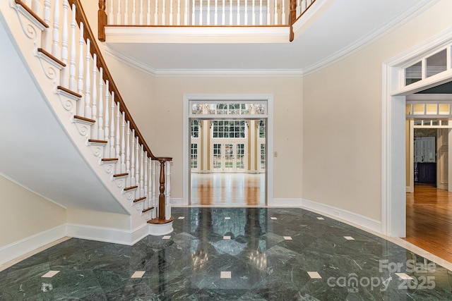 517 Kingsdown Ct, Waxhaw, NC 28173 - foyer featuring stairs, marble tiled flooring, ornamental molding, and a towering ceiling