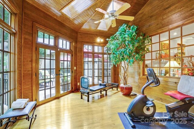 517 Kingsdown Ct, Waxhaw, NC 28173 - workout room with high vaulted ceiling, french doors, a skylight, wooden ceiling, and wood walls