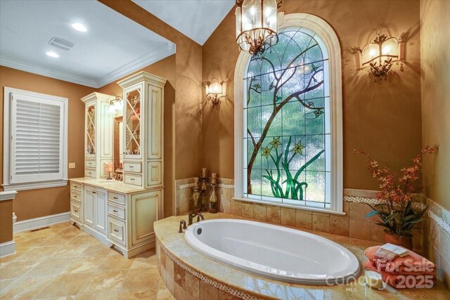 517 Kingsdown Ct, Waxhaw, NC 28173 - bathroom featuring vanity, a bath, a chandelier, and ornamental molding